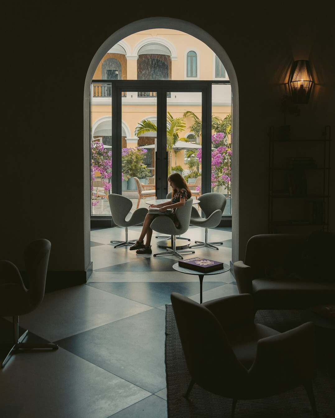Woman typing on a laptop in an office setting