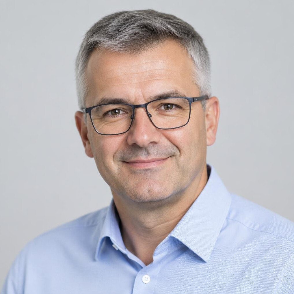 Studio portrait of a professional man with glasses