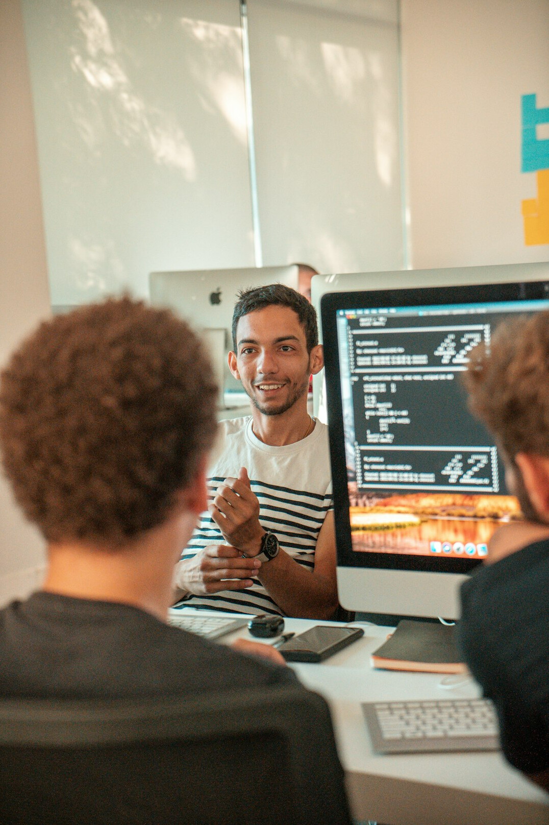 corporate programmers discussing code